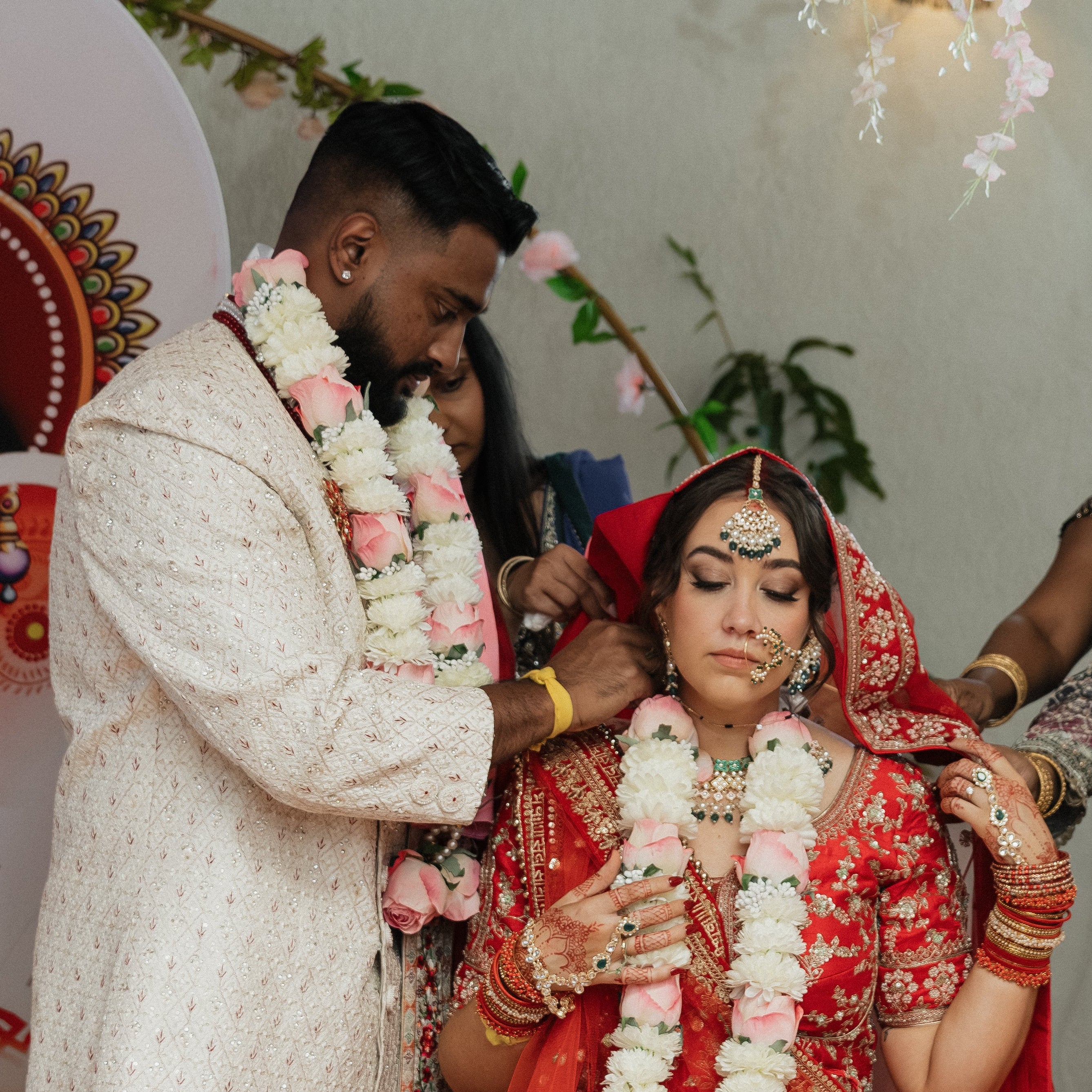 mangalsutra tied by groom on his bride at their wedding next to The Always mangalsutra by Sutraa Jewels