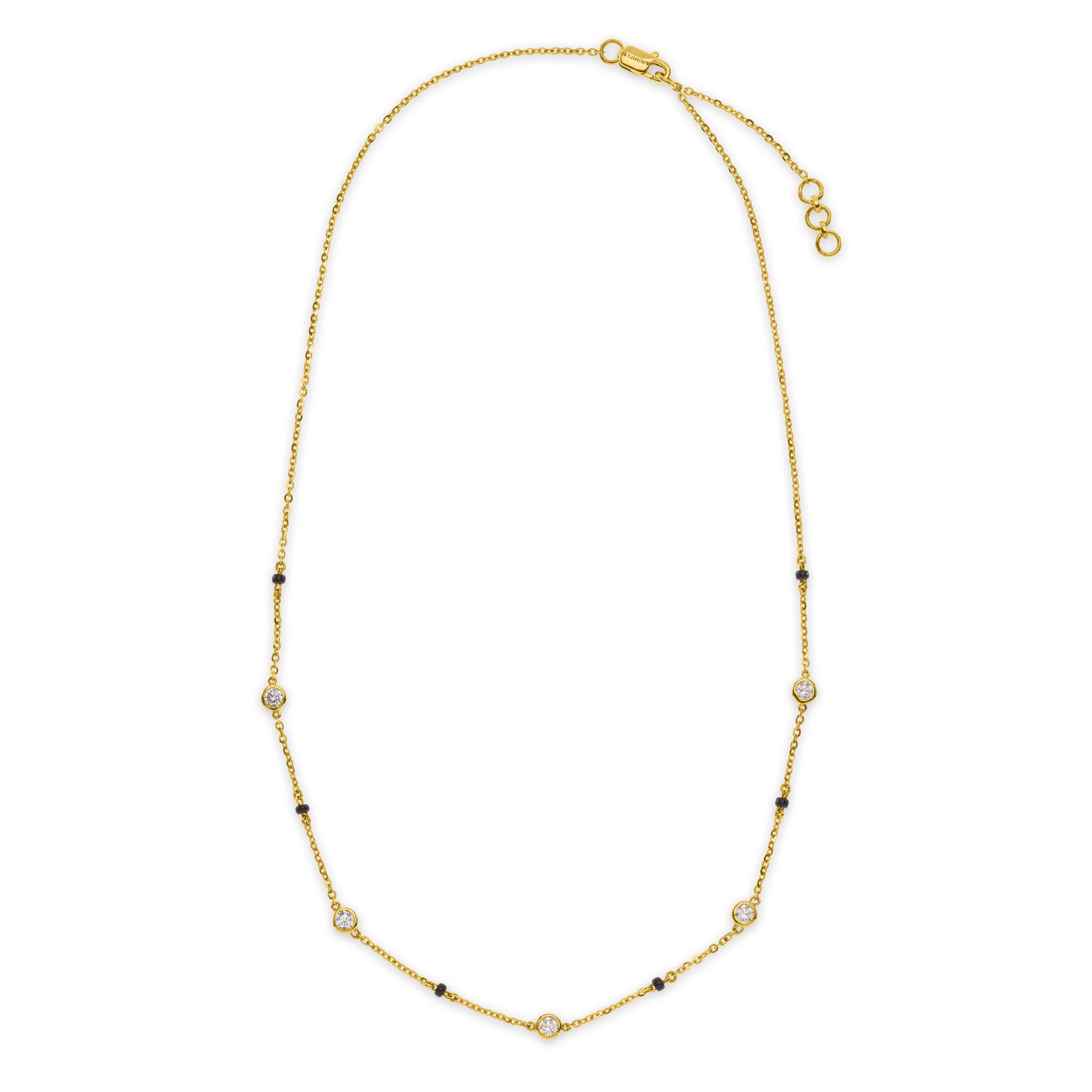 The Unity mangalsutra necklace in 18k gold with round lab grown diamonds on station pendant and black beads, lobster clasp closure, on white background