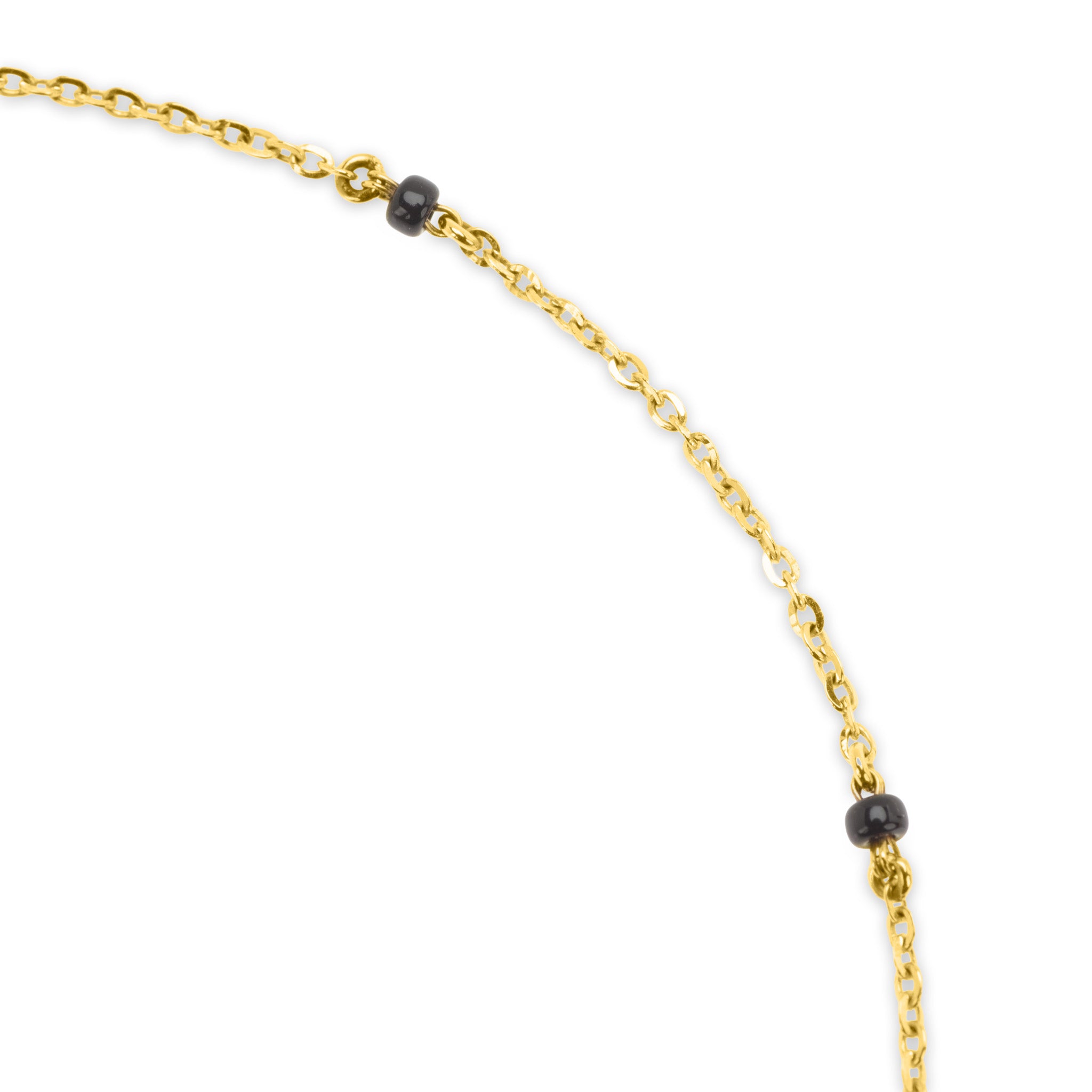 Detail of 18k gold cable chain with black bead accents on The Devotion mangalsutra necklace, on white background