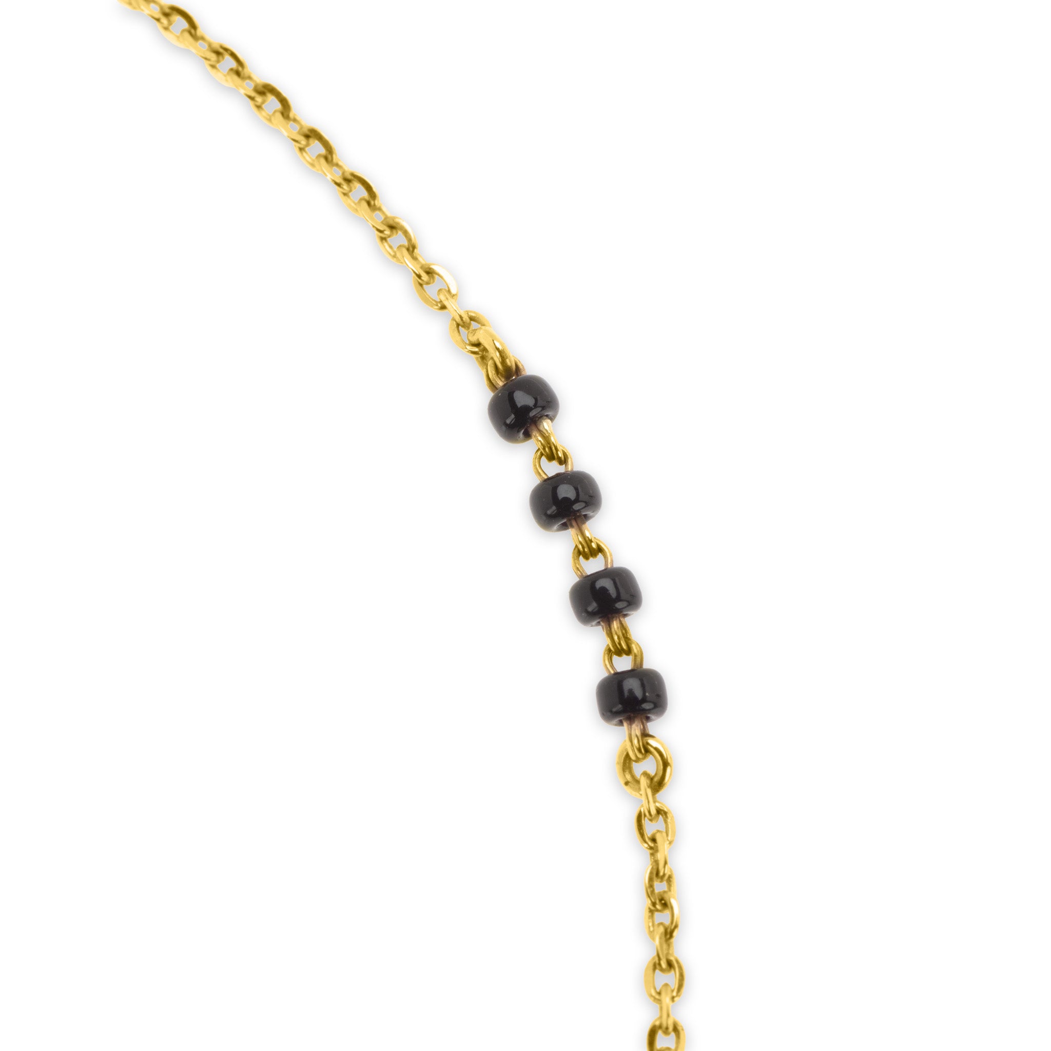 Detail of 18k gold cable chain with black bead accents on The Duet mangalsutra necklace, on white background