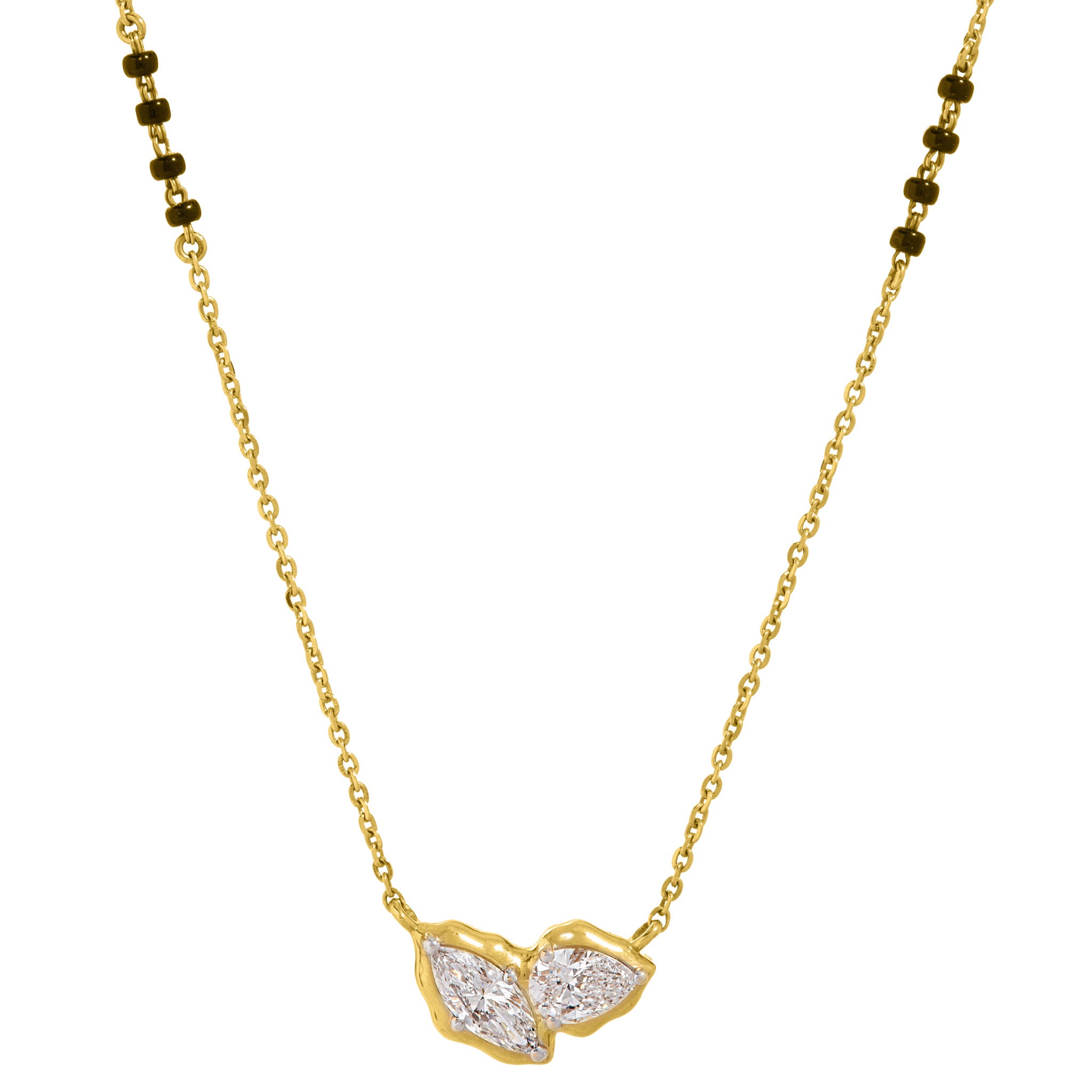 Close-up of toi et moi marquise and pear lab-grown diamond pendant on The Duet mangalsutra necklace, 18k gold chain with black beads on white background.